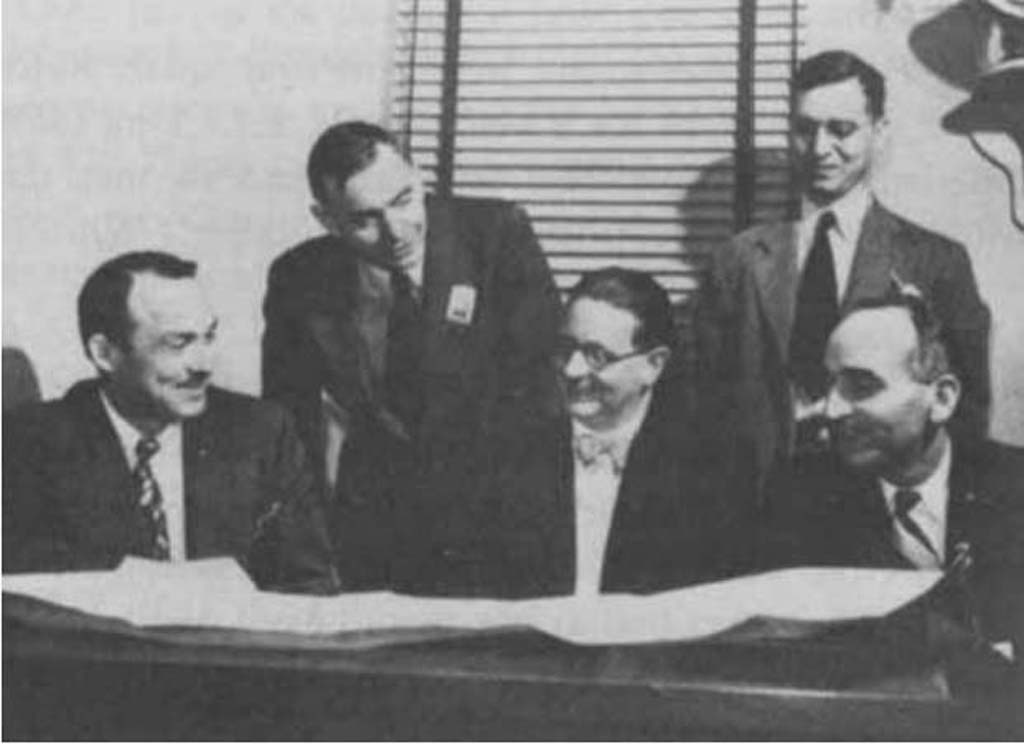 Drs. Clark, Bucer, Grimmet, Roy Heflebower (hospital administrator), and Fletcher (L. to R), review plans for their Co-60 unit